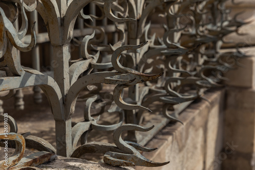 Fragment of a wall with rods in an exotic style close-up.