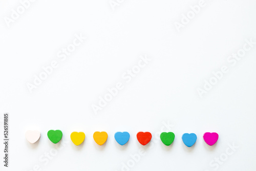 Colored figures in the form of heart on a white background © ALEXSTUDIO