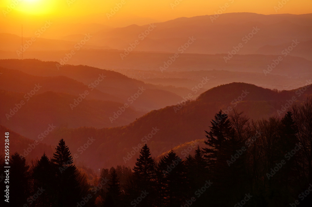 Colorful landscape with trees and mountains; sunrise view from Králiky, Slovakia