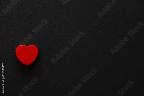 Red heart on black background