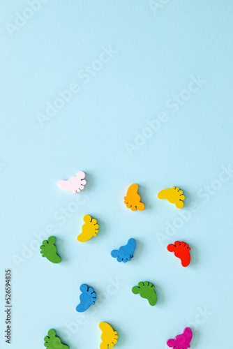 Colored figures in the form of legs on a blue background © ALEXSTUDIO