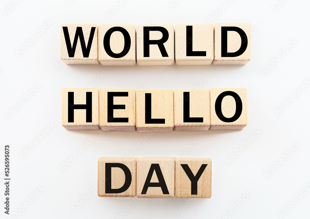 Wooden cubes with text WORLD HELLO DAY on white background