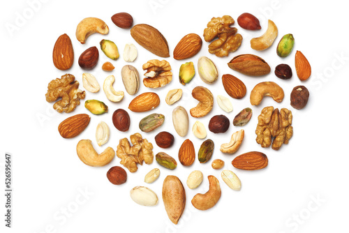 Pattern of nuts in the form of a heart Various nuts isolated on white Pecans macadamia nuts brazil nuts walnuts almonds hazelnuts pistachios cashews peanuts, pine nuts Top view Flat Сopy space