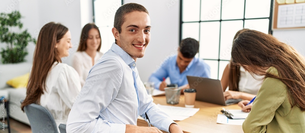 Group of business workers smiling happy working at the office. Group of business workers smiling happy working at the office.