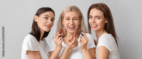 Happy young women applying ...