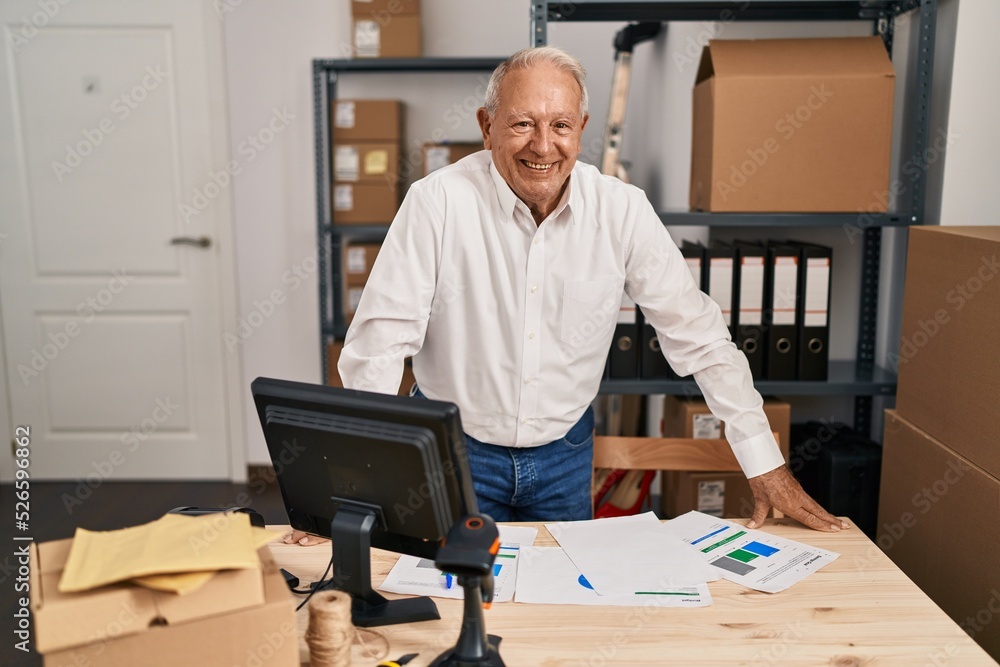 Senior man ecommerce business worker standing at office Senior man ecommerce business worker standing at office
