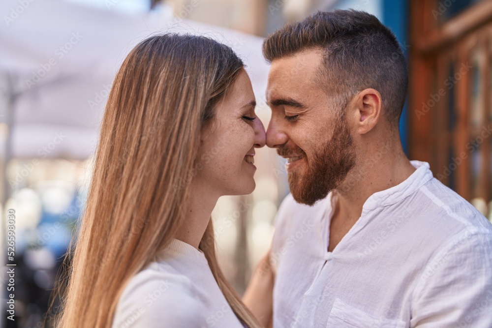 Man and woman couple smiling confident hugging each other at street Man and woman couple smiling confident hugging each other at street