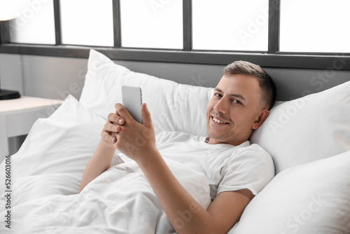 Young man using mobile phon...