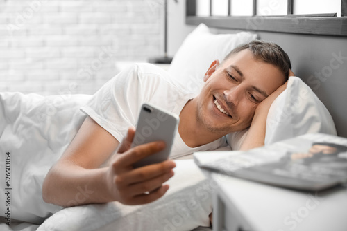 Young man using mobile phon...