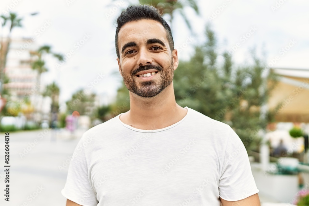 Young hispanic man smiling confident walking at street Young hispanic man smiling confident walking at street