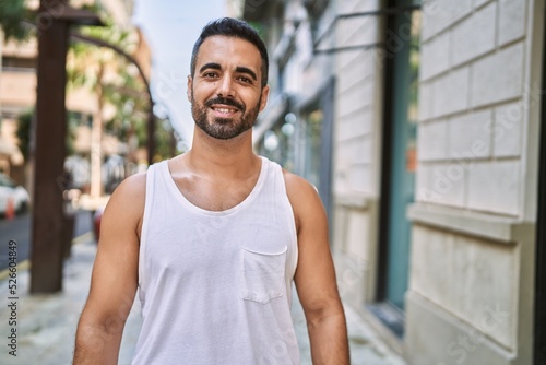 Hispanic sports man wearing workout style outdoors on a sunny day