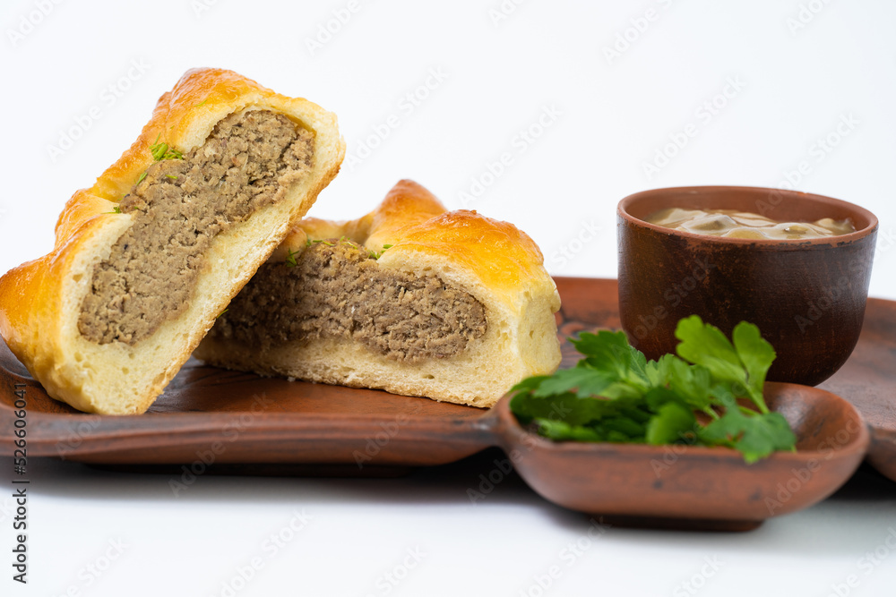 Ukrainian traditional bun with meat and sauce
