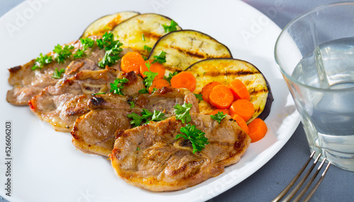 Delicious grilled marinated mutton chops with roasted eggplant and carrot