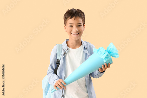 Little boy with blue school...