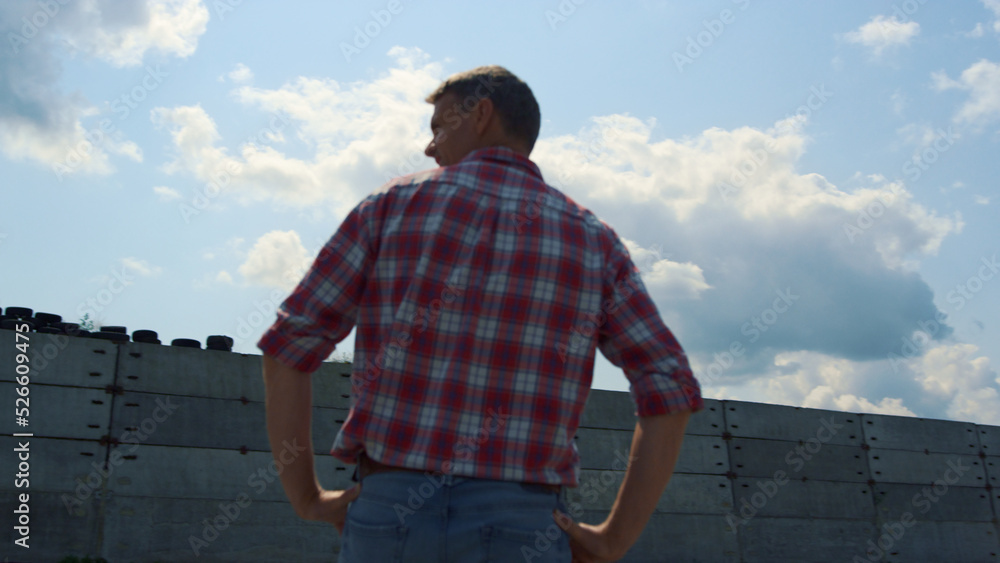 Fototapeta premium Building specialist inspecting construction new technological barn close up.