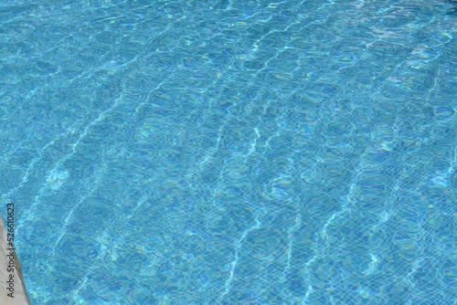 Clear refreshing water in swimming pool on sunny day, closeup