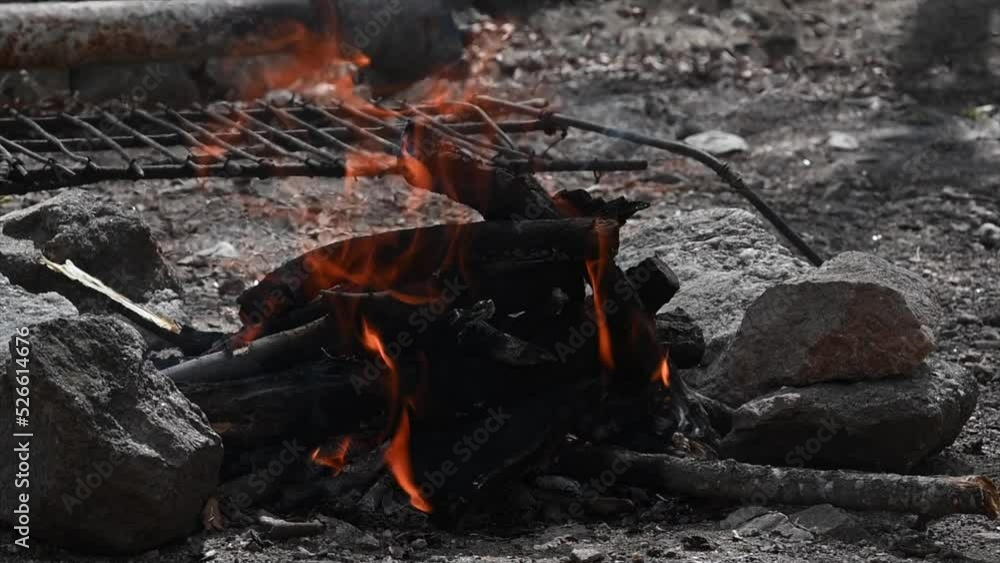 wood campfire on land cared for with stones so that it does not spread to make roast meat wood campfire on land cared for with stones so that it does not spread to make roast meat