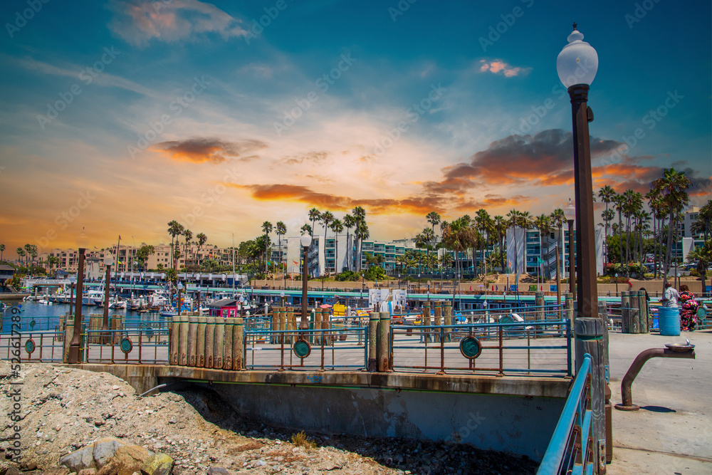 a summer day at the Redondo Beach pier with boats in the