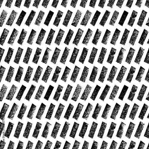 Diagonal bold charcoal short lines seamless pattern. Hand drawn black vector geometric ornament. Graphic dashed strokes pattern with dry texture. Retro black and white ornament. Dry brushstrokes