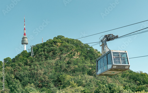 Green forest on a mountain and cable car view of Namsan Seoul tower park in Seoul South Korea