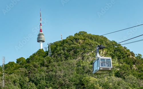 Green forest on a mountain and cable car view of Namsan Seoul tower park in Seoul South Korea