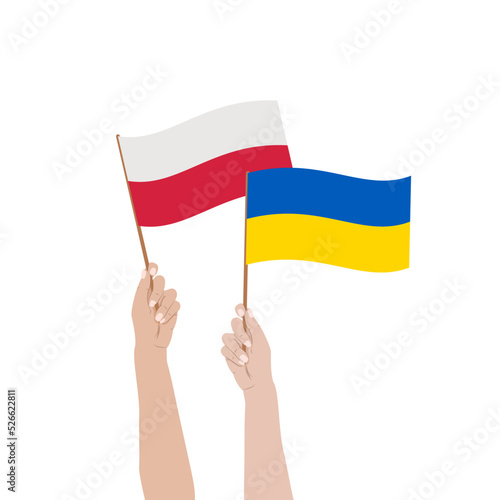 Flagi Polski i Ukrainy w uniesionych rękach. Braterstwo i siostrzeństwo dwóch narodów. Wsparcie i współpraca Polski i Ukrainy.