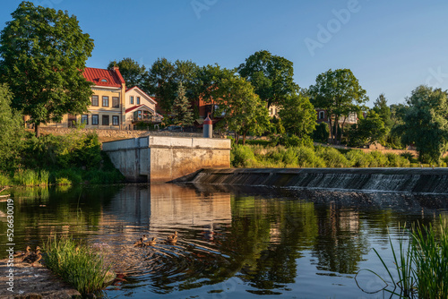 View of the embankment and the dam on the Pskova River on a sunny summer day, Pskov, Russia photo