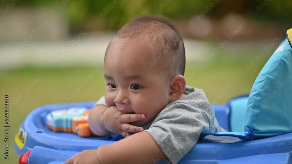Asian baby playing outdoor, Japanese baby innocence on playground Asian baby playing outdoor, Japanese baby innocence on playground