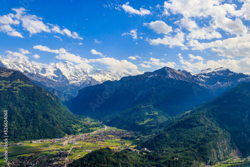 Breathtaking aerial view of Interlaken and Swiss Alps from Harder Kulm viewpoint, Switzerland © olyasolodenko