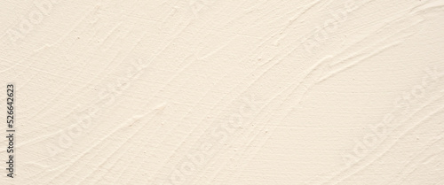 Cream concrete stone surface paint wall background, Grunge cement paint texture backdrop, Cream rough concrete stone wall background, Copy space for interior design background, banner, wallpaper