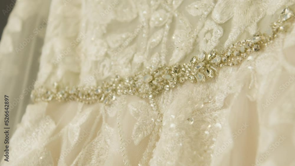 Lacy wedding dress up close detail, macro shot. Bridal Luxury beautiful mesh wedding gown. Shot on 5k RED GEMINI. Lacy wedding dress up close detail, macro shot. Bridal Luxury beautiful mesh wedding gown. Shot on 5k RED GEMINI.