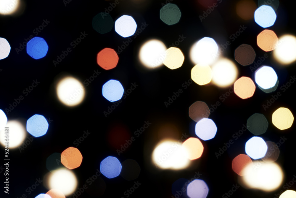 Fototapeta premium multicolored festive lights on a black background screensaver backdrop