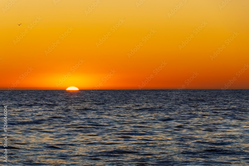 Amazing sunset on the Atlantic Ocean. The sun reflected in the waves Amazing sunset on the Atlantic Ocean. The sun reflected in the waves