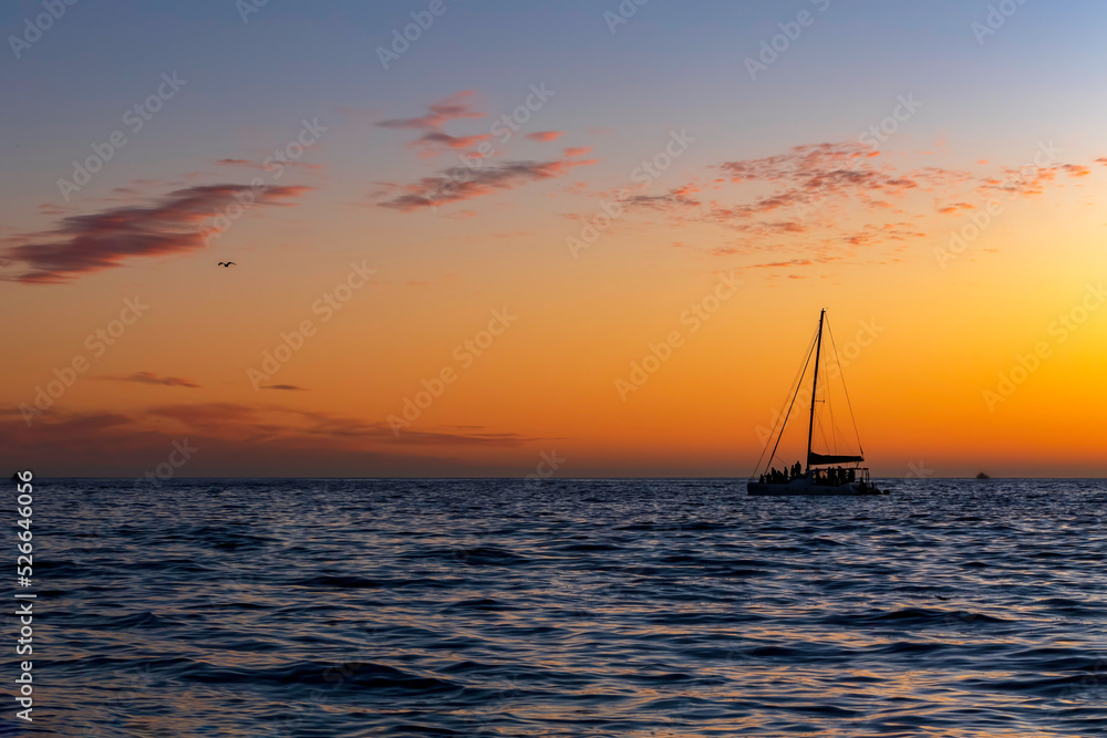 Sea yachts against the background of the sun reflected in the waves Sea yachts against the background of the sun reflected in the waves