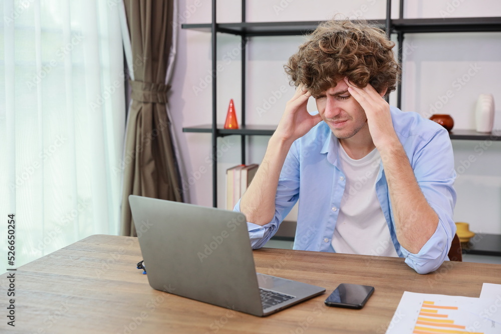 Young adult businesswoman touching his head on table in office after bad news business failure or get fired and feeling discouraged, distraught and hopeless in modern office. Young adult businesswoman touching his head on table in office after bad news business failure or get fired and feeling discouraged, distraught and hopeless in modern office.