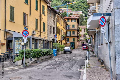 Fototapeta Naklejka Na Ścianę i Meble -  Lake Como, Italy - July 4, 2022: Idyllic scenery and architecture on the streets and pathways around Lake Como, Italy
