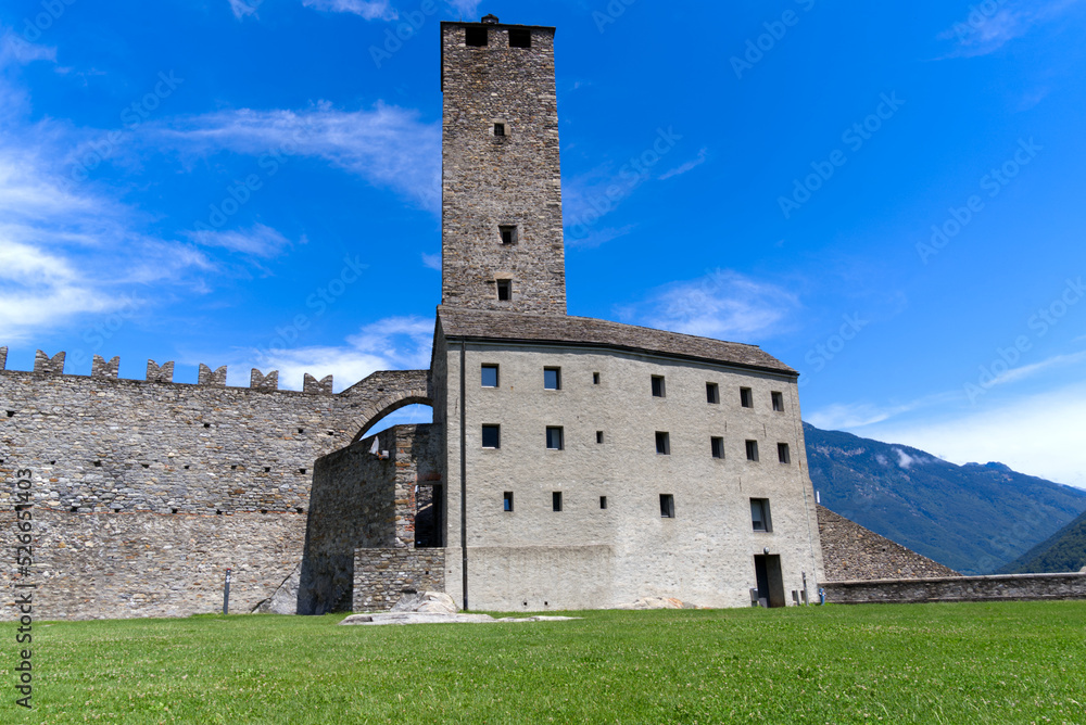 Scenic view of Unesco world heritage castle Castelgrande at City of Bellinzona, Canton Ticino, on a blue cloudy summer day. Photo taken July 4th, 2022, Bellinzona, Switzerland.