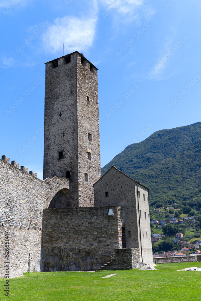 Scenic view of Unesco world heritage castle Castelgrande at City of Bellinzona, Canton Ticino, on a blue cloudy summer day. Photo taken July 4th, 2022, Bellinzona, Switzerland.