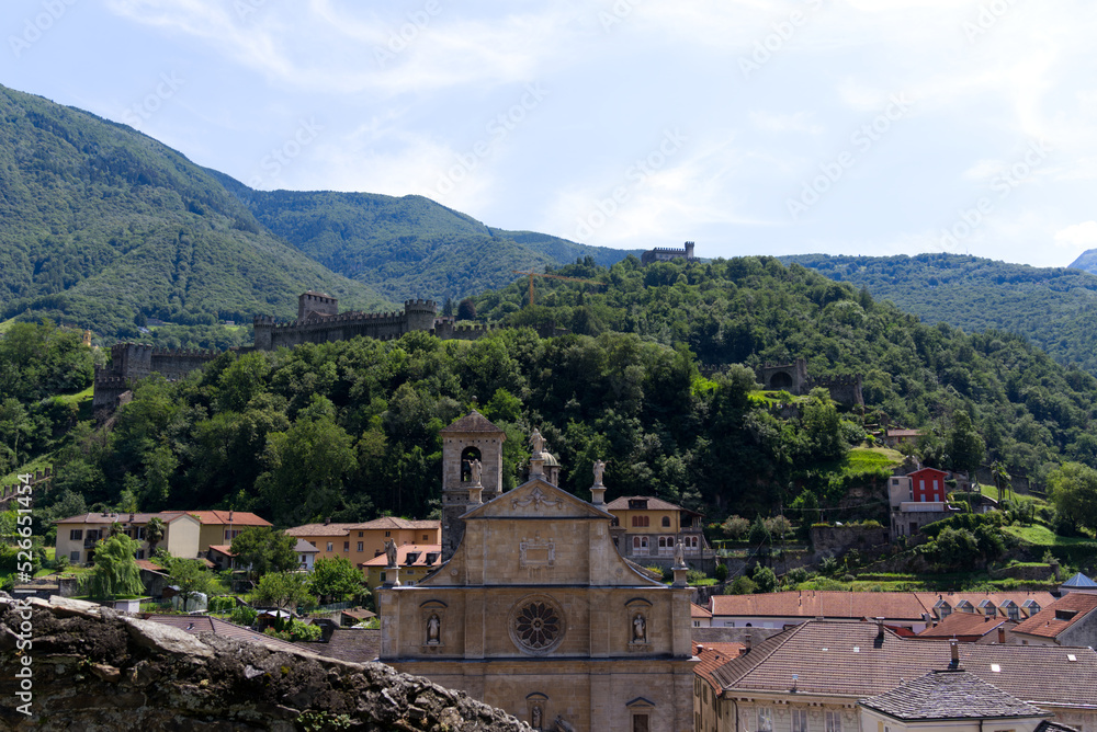 Famous Unesco Word Heritage castles Montebello and Sasso Gorbaro with collegiate church in at City of Bellinzona on a sunny summer day. Photo taken July 4th, 2022, Bellinzona, Switzerland.