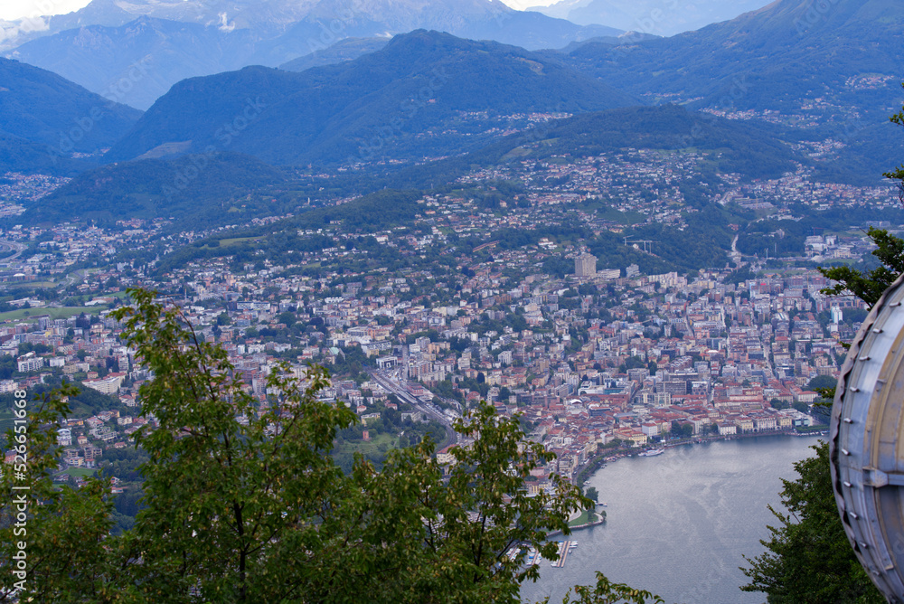 erial view of City of Lugano seen from local mountain San Salvatore on a sunny summer day. Photo taken July 4th, 2022, Lugano, Switzerland.