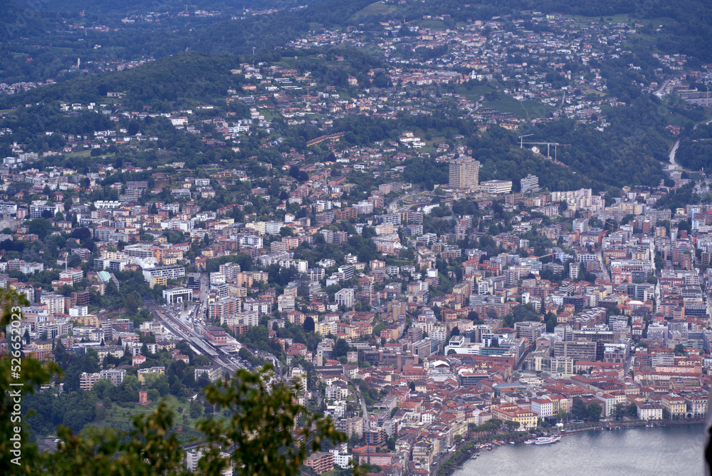 erial view of City of Lugano seen from local mountain San Salvatore on a sunny summer day. Photo taken July 4th, 2022, Lugano, Switzerland.