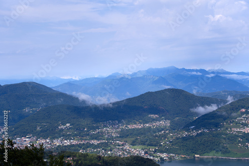 Aerial scenic view over region of Lugano, Canton Ticino, on a cloudy summer day. Photo taken July 4th, 2022, Lugano, Switzerland. © Michael Derrer Fuchs