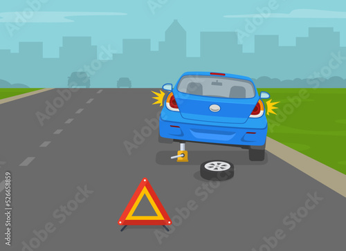 Back view of broken blue car. Changing flat tire using car jack. Red breakdown triangle stands behind the broken car on road side. Flat vector illustration template.
