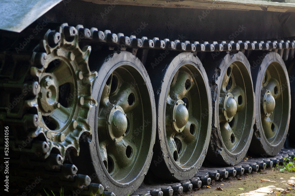 Fragment of the caterpillar of an old tank with traces of damage Fragment of the caterpillar of an old tank with traces of damage