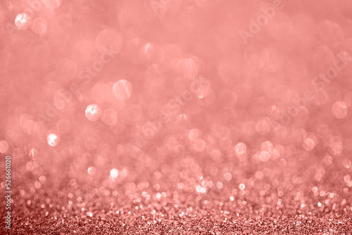 Diamond lcoral bokeh texture with sparklingparticles festive , christmas , party, winter y etc magic abstract background.