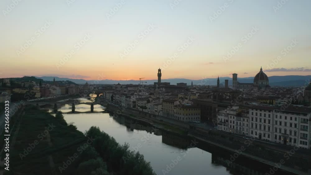Drone Descends Over the Arno River in Florence, Italy at Sunset Drone Descends Over the Arno River in Florence, Italy at Sunset