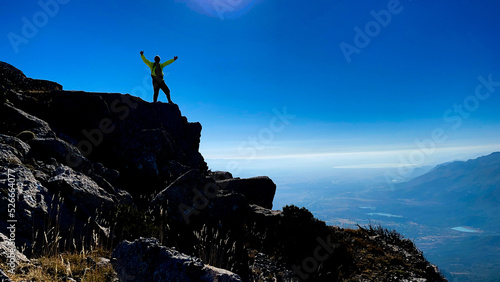 successful mountaineer on the summit cliffs