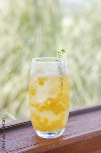 glass of lemonade on wooden table
