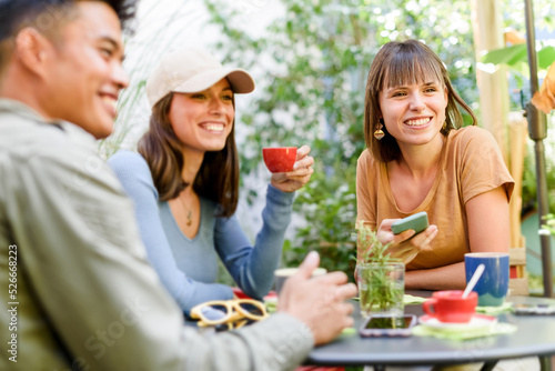 Cheerful people enjoying coffee break together