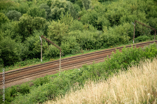 railway track among green trees top view